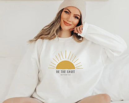 Sudadera unisex con cuello redondo "Be The Light"